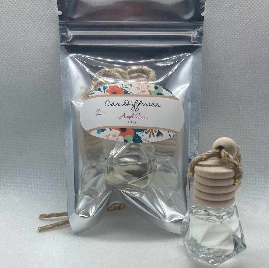 Angel Rossa car diffuser with floral and fruity scent inspired by Escada, featuring citrus, mango, berries, and pineapple notes in clear bottle with wooden cap and hanging rope.