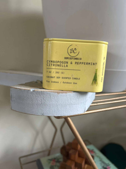 Cymbopogon &amp; Peppermint Citronella 7oz coconut soy scented candle in a yellow container for indoor and outdoor use