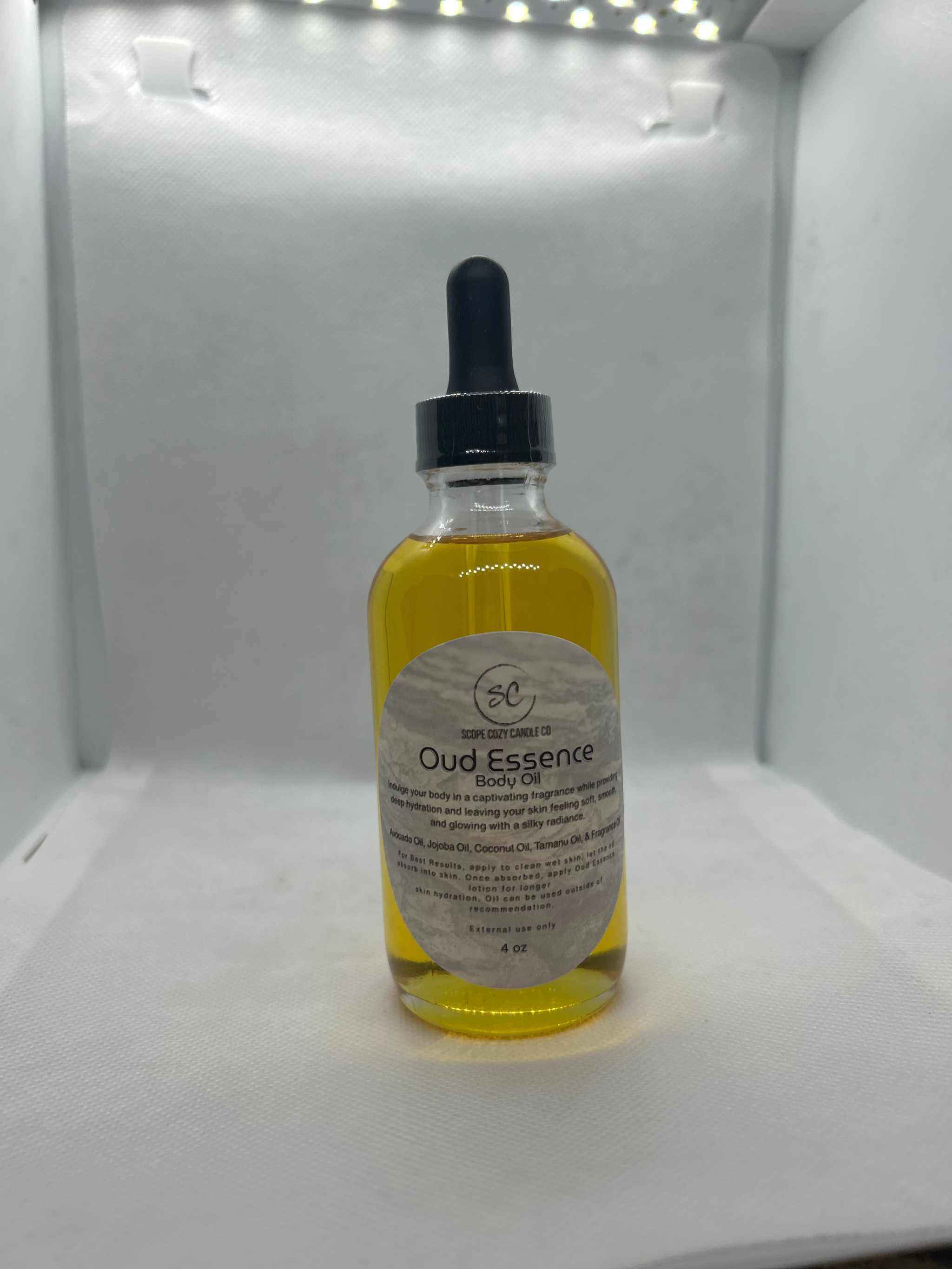 4oz bottle of Oud Essence Body Oil with natural moisturizing oils and long-lasting, gender-neutral Oud and Tonka fragrance