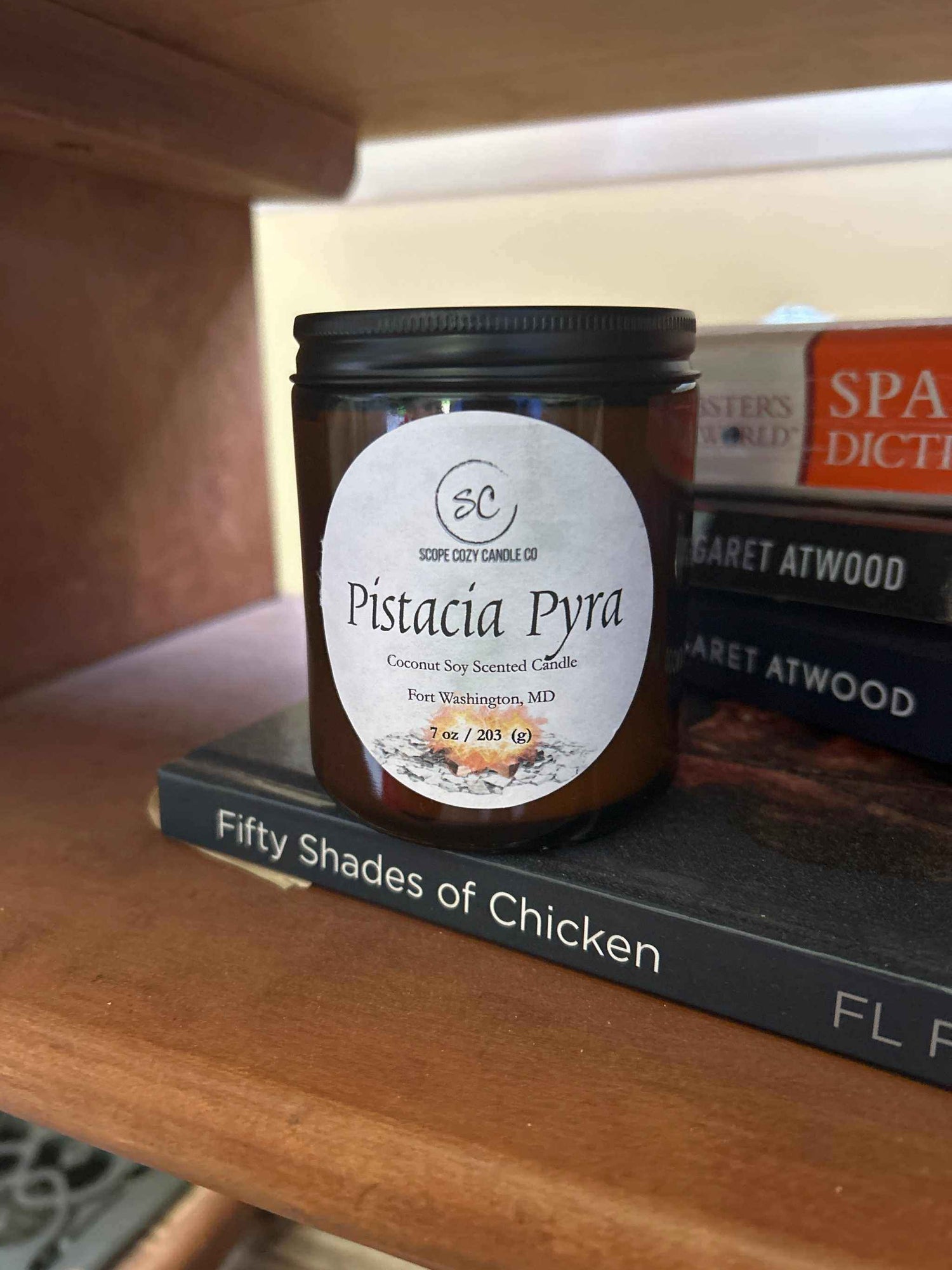Pistacia Pyra Coconut Soy Scented Candle 7oz with cozy fall fragrance of maple, orange, pistachio, vanilla, and smoke in amber jar