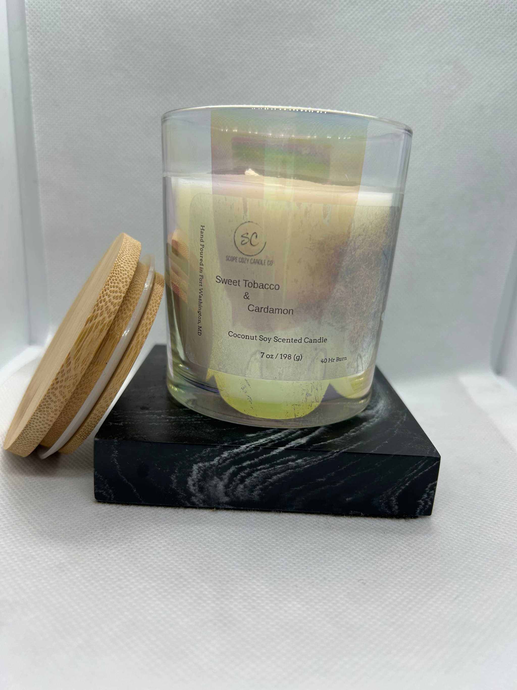 7oz Sweet Tobacco &amp; Cardamom scented coconut soy wax candle with wooden lid on black marble base