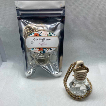 Angel Rossa car diffuser with floral and tropical fruity scent in clear glass bottle and rope for hanging