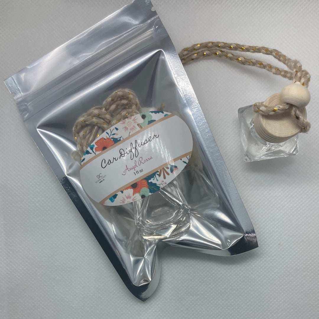 Angel Rossa car diffuser with floral tropical scent featuring citrus, mango, berries, and pineapple notes in a clear glass bottle with braided hanging rope.