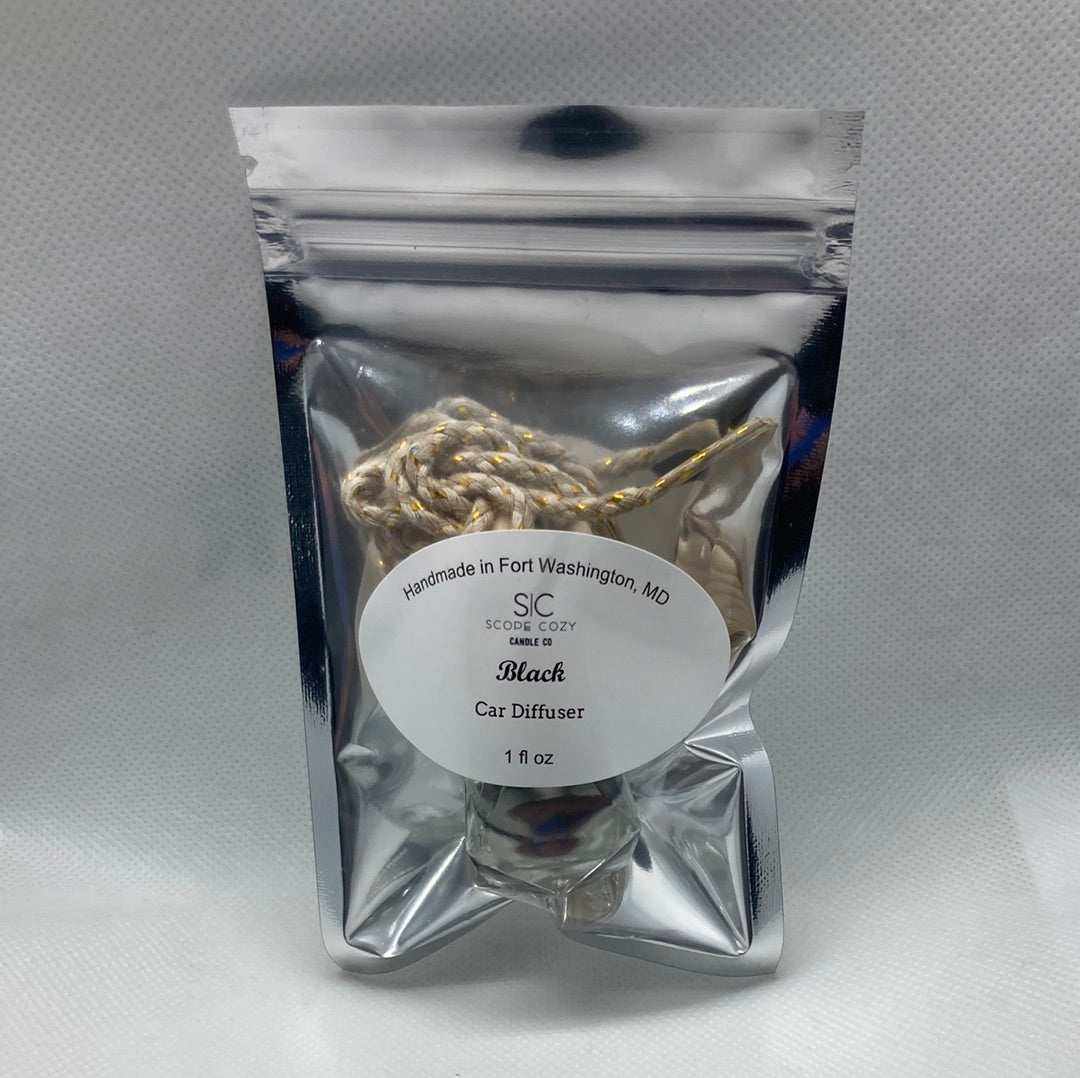 Black hanging diffuser with bold black cardamom scent in resealable silver packaging