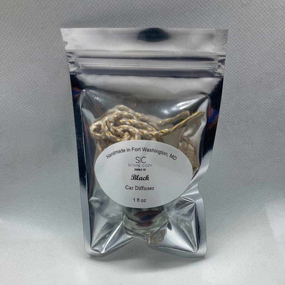 Black hanging diffuser with bold black cardamom scent in resealable silver packaging